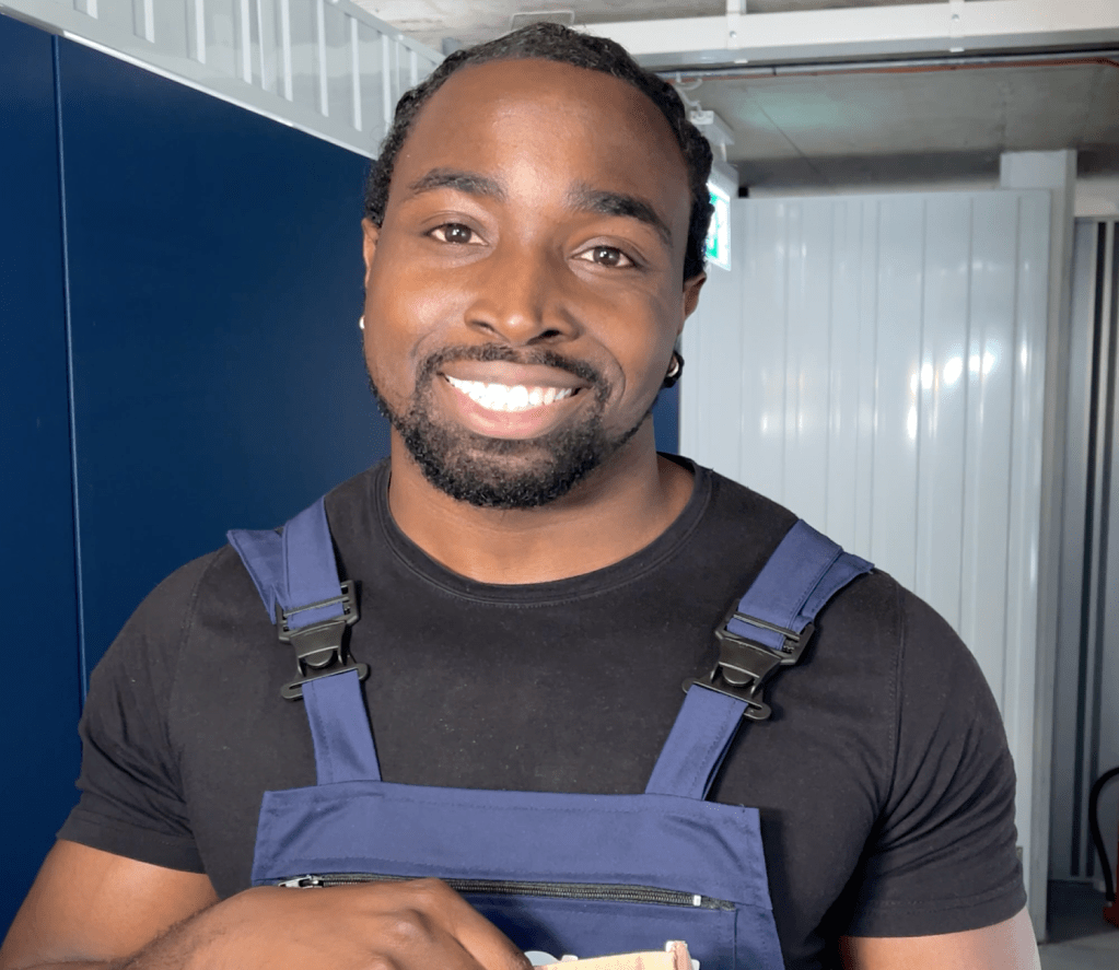 Student using Smartroom self storage in London, placing boxes and luggage into a secure unit during end-of-term move.